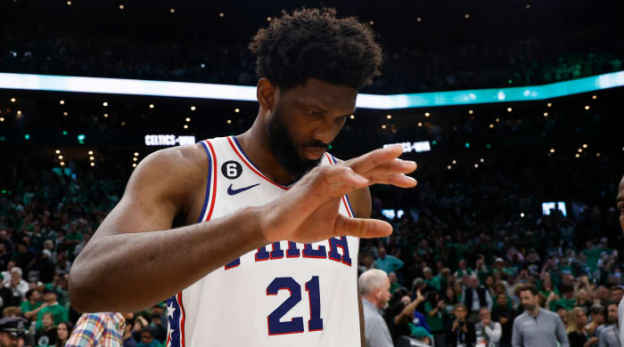 76ers guard James Harden drives toward the basket past Celtics guard Derrick White